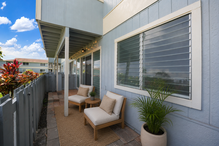 Private fenced courtyard with seating