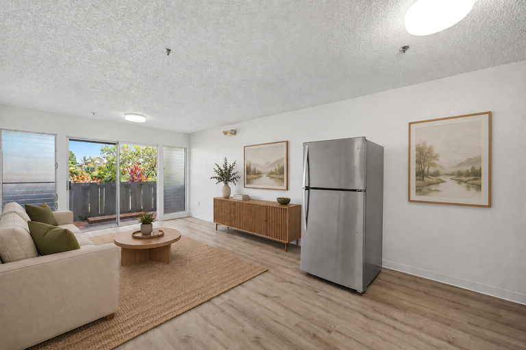 Living room view toward refrigerator and lanai